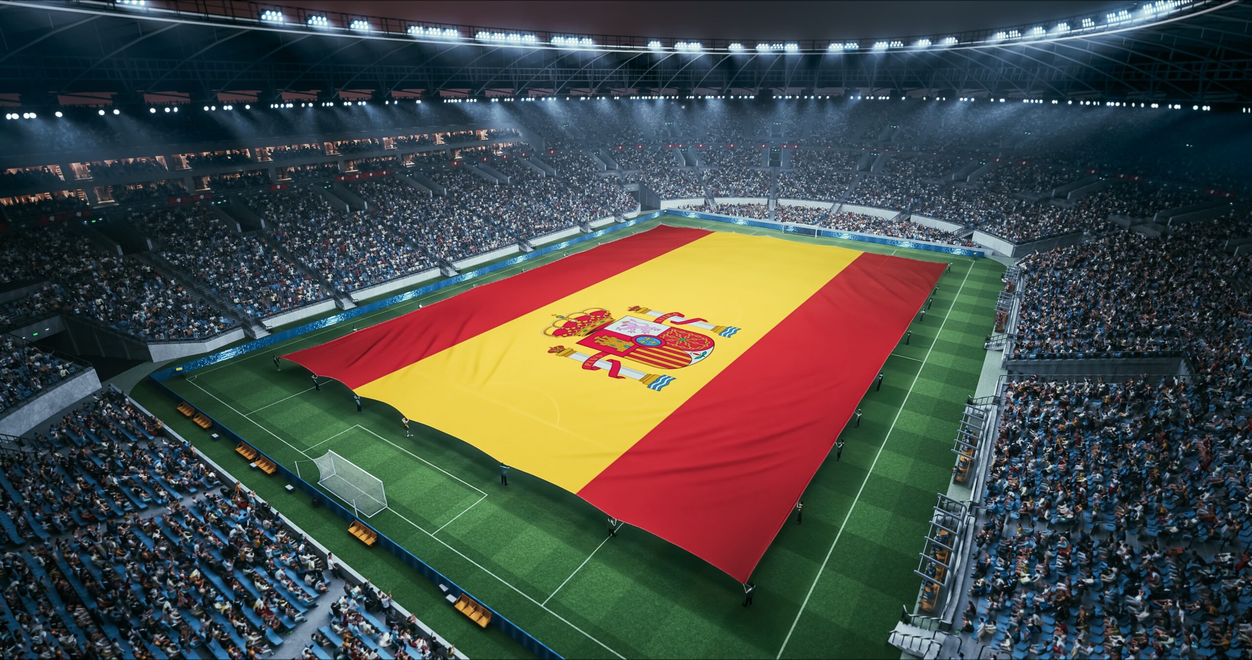 Spain's Flag spread open on a soccer field.